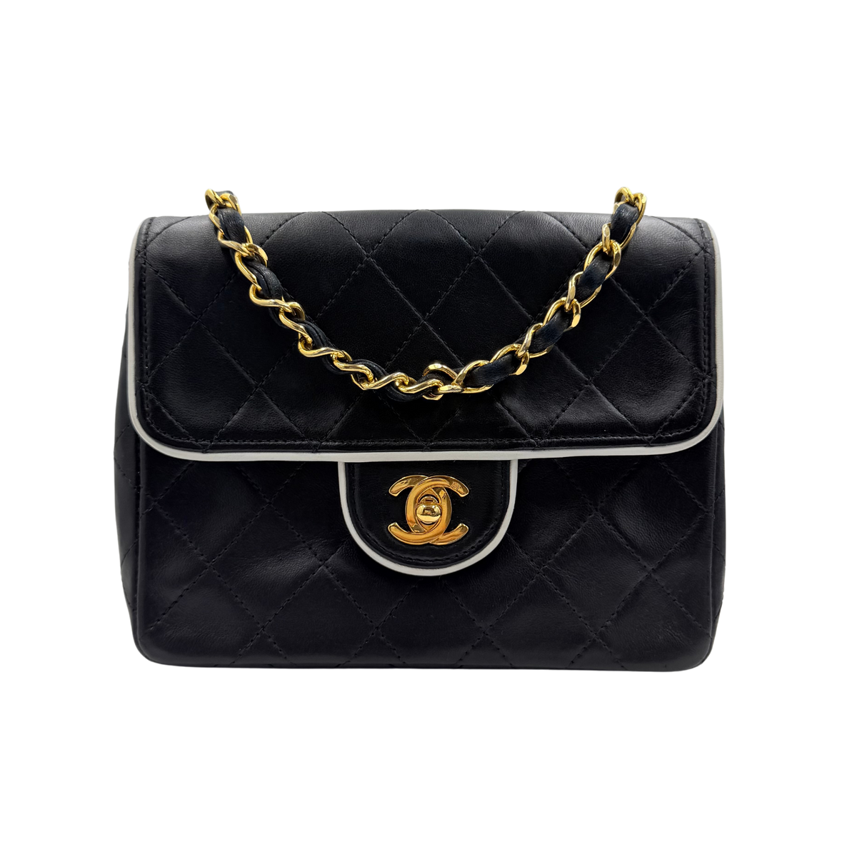 Chanel black quilted lambskin mini flap, front view with contrast piping and gold-tone CC turn-lock