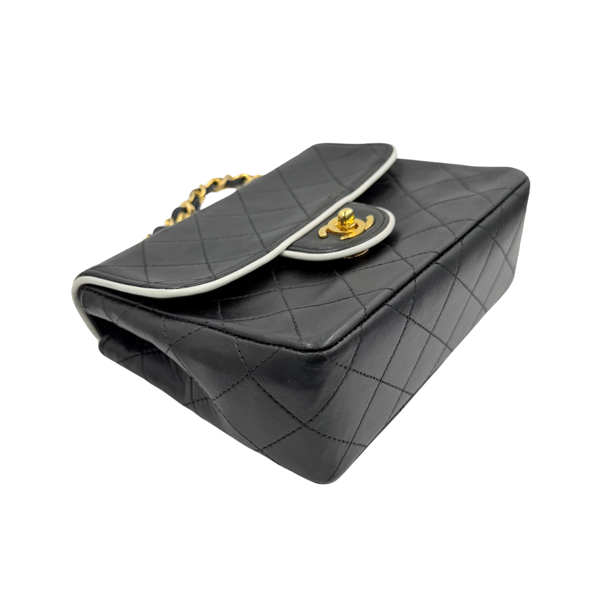 Chanel black quilted lambskin mini flap, angled base and corner view
