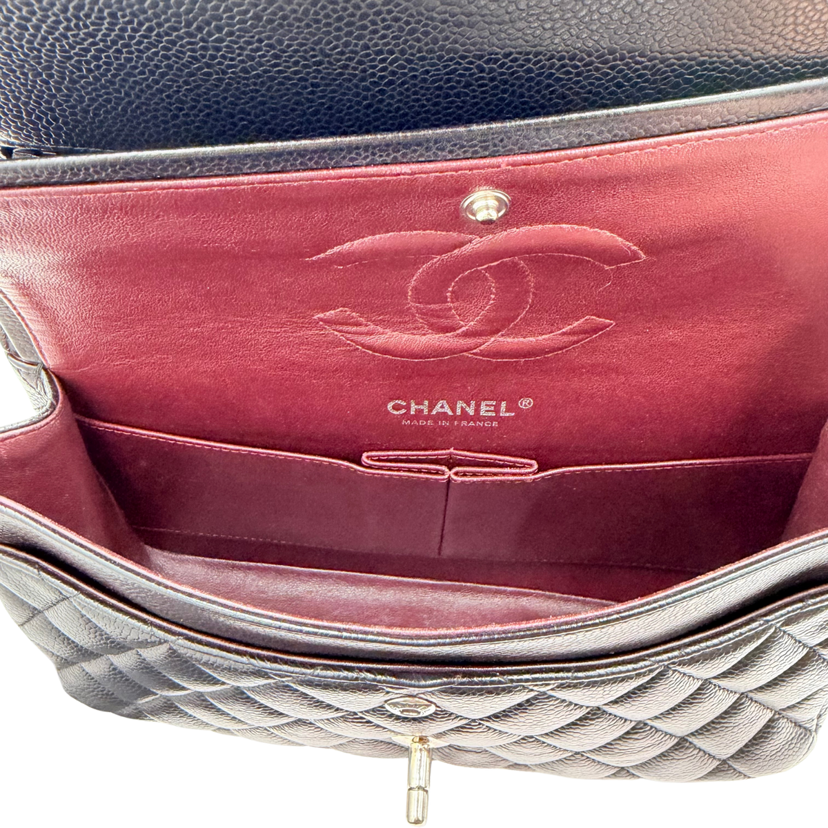 Chanel Medium Classic Flap burgundy interior with stitched CC motif, slip pockets, and Chanel Made in France stamp