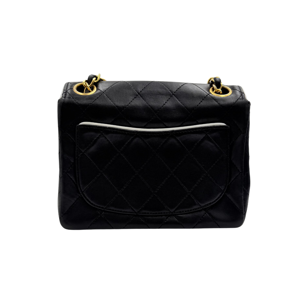 Chanel black quilted lambskin mini flap, rear view showing piped slip pocket