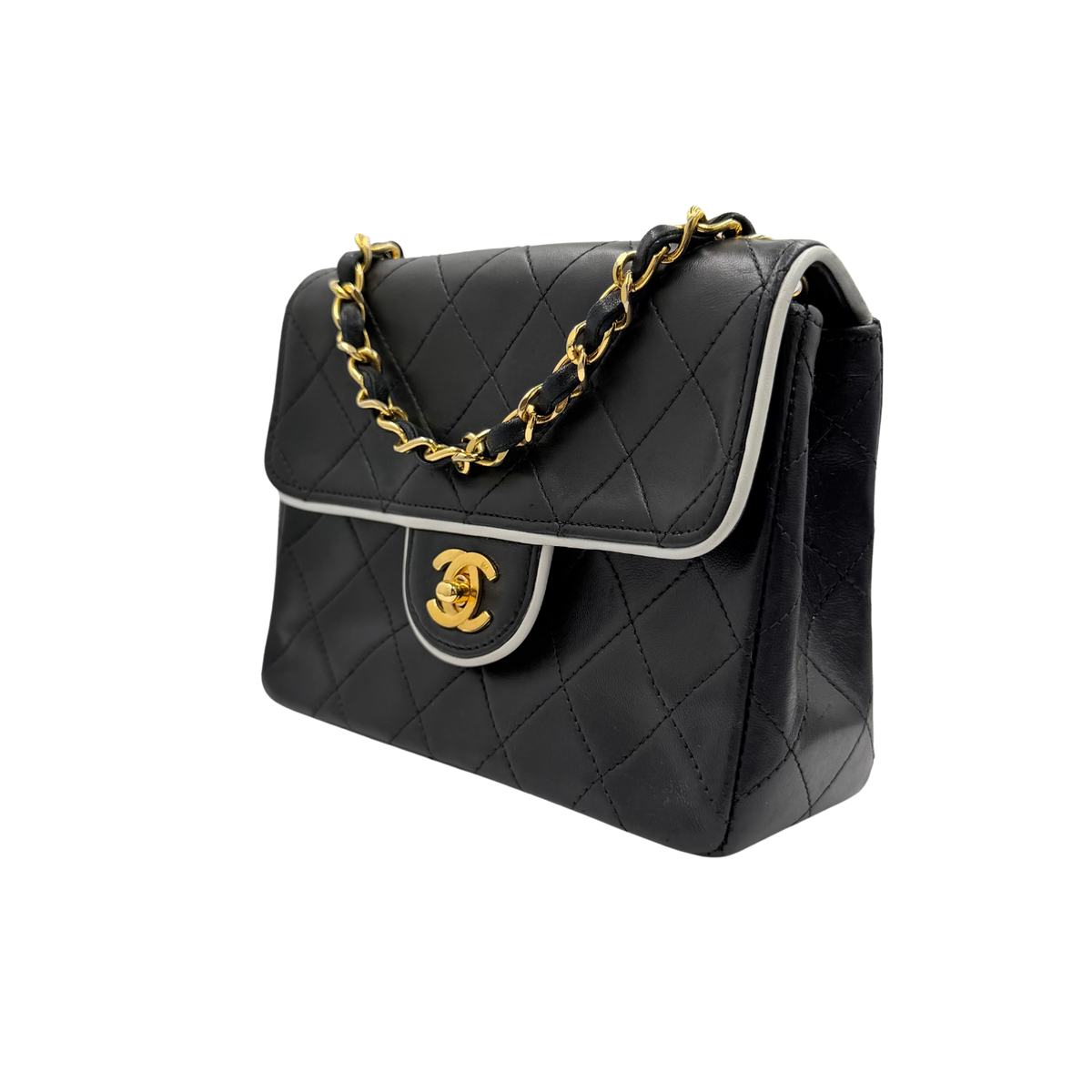 Chanel black quilted lambskin mini flap, opposite front three-quarter view