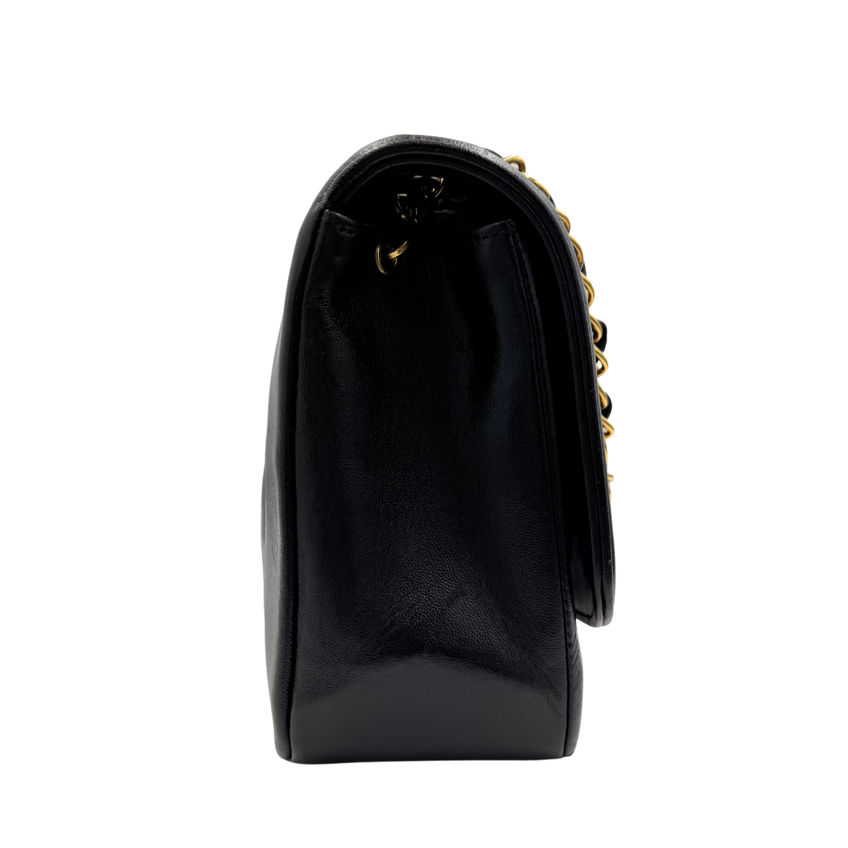 Chanel black Diana Medium flap bag, side profile showing flap and strap attachment